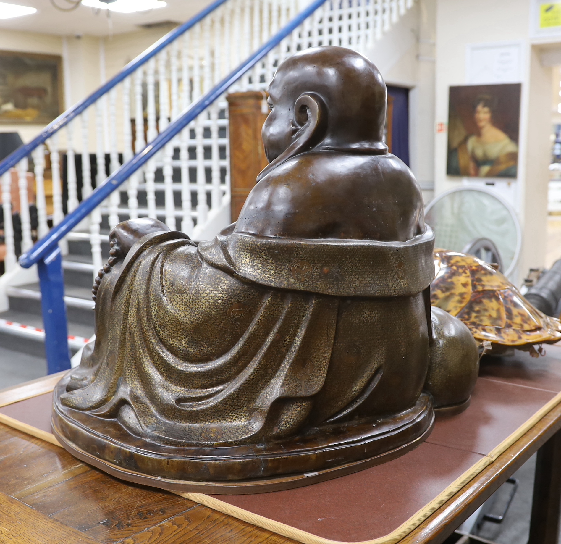 A massive Chinese bronze seated figure of Budai, 62cm high
